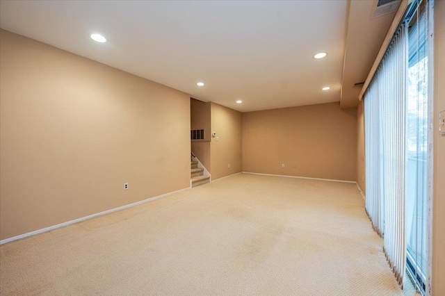 unfurnished room with light carpet