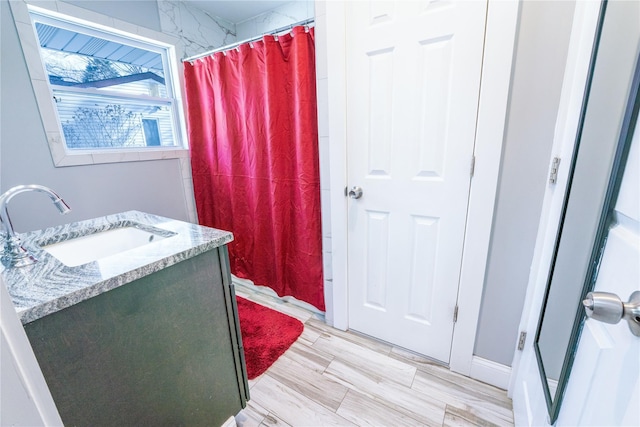 bathroom with vanity and curtained shower