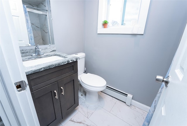 bathroom featuring toilet, vanity, a shower with shower door, and a baseboard heating unit