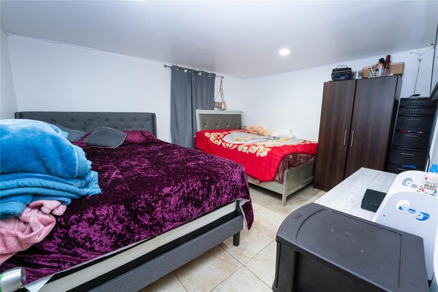 bedroom with light tile patterned flooring