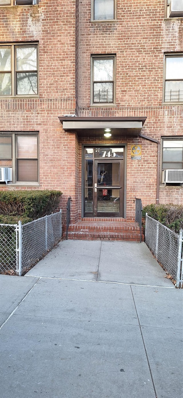 doorway to property featuring cooling unit