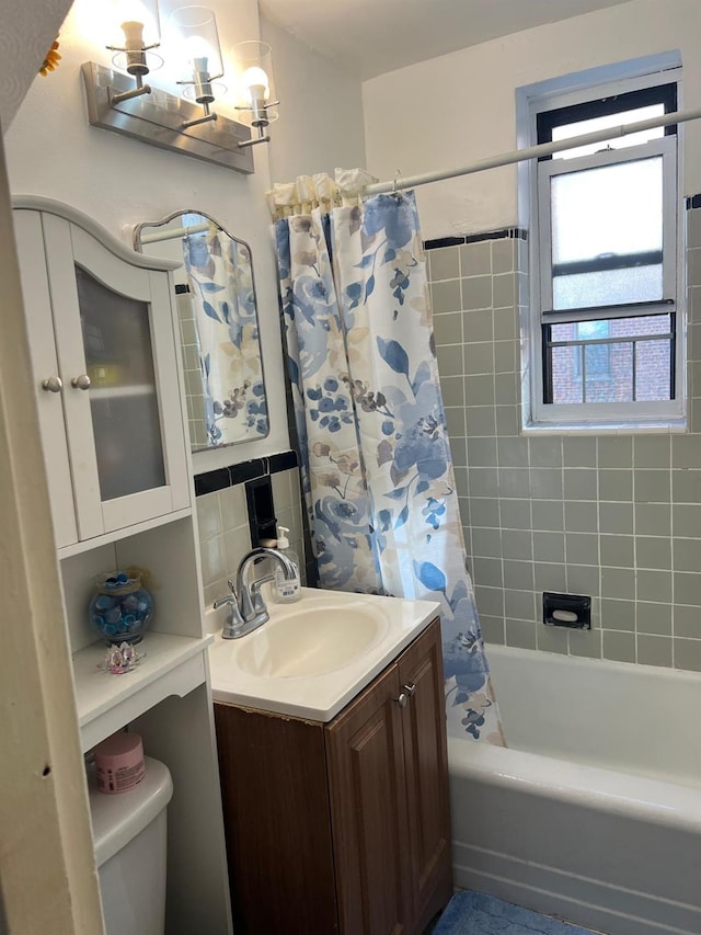 full bathroom with vanity, toilet, shower / bath combo with shower curtain, and backsplash