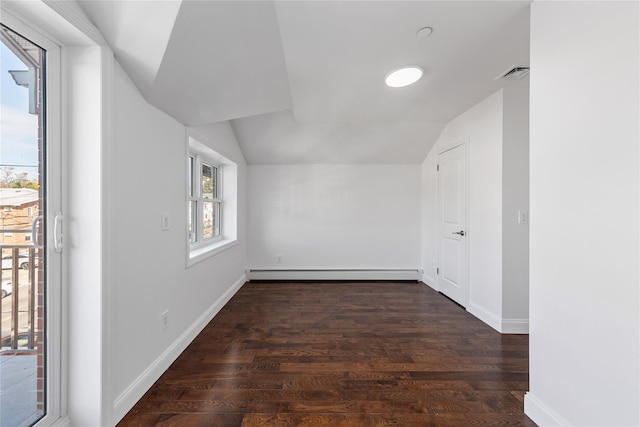 bonus room with dark hardwood / wood-style flooring, lofted ceiling, and a baseboard radiator