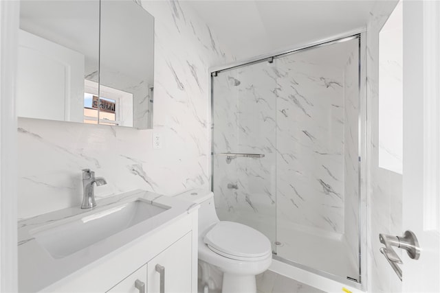 bathroom with walk in shower, vanity, tile walls, and toilet