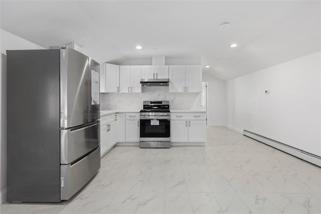 kitchen featuring white cabinets, tasteful backsplash, appliances with stainless steel finishes, and vaulted ceiling