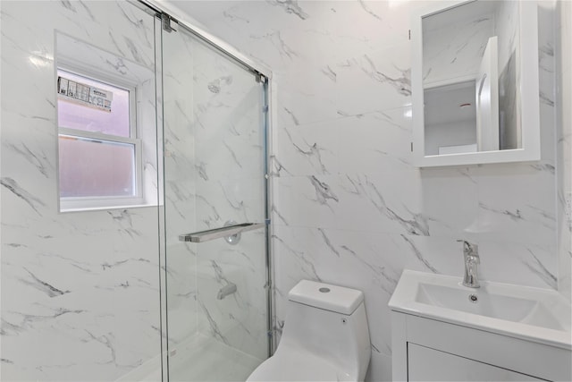 bathroom featuring vanity, toilet, and a shower with shower door