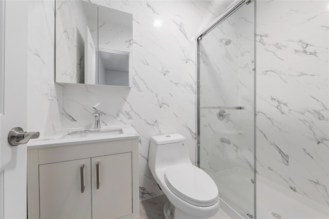 bathroom featuring vanity, toilet, an enclosed shower, and tile walls