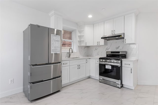 kitchen featuring backsplash, sink, white cabinetry, and stainless steel appliances