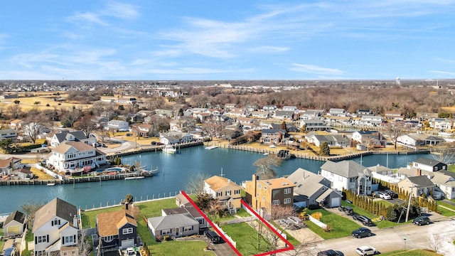 bird's eye view with a water view and a residential view