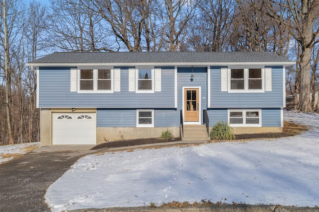 bi-level home featuring a garage