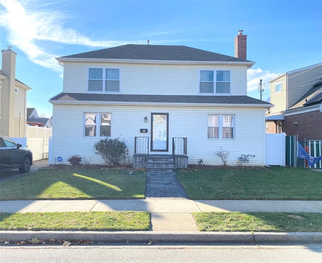 view of front of home featuring a front yard