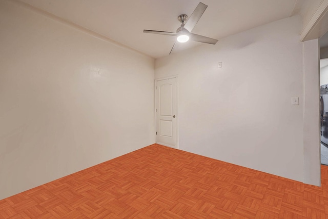 empty room featuring light parquet flooring and ceiling fan