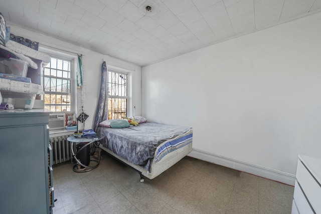 bedroom with cooling unit and radiator heating unit