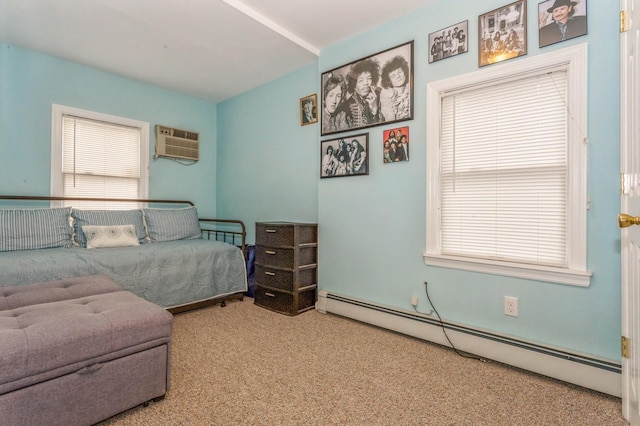 carpeted bedroom with an AC wall unit and a baseboard heating unit