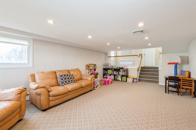 game room featuring a healthy amount of sunlight and light carpet