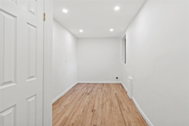 empty room with light hardwood / wood-style flooring