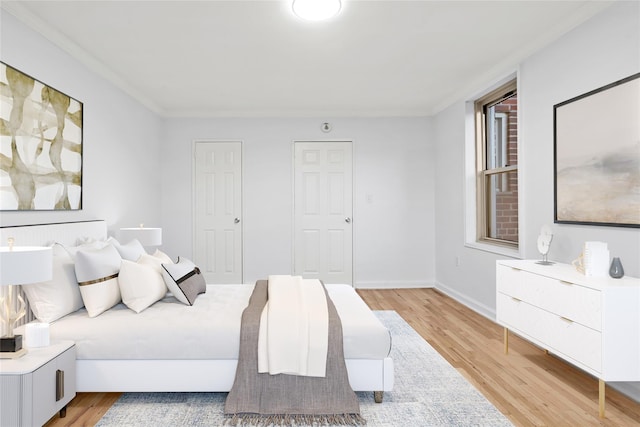 bedroom with light hardwood / wood-style floors