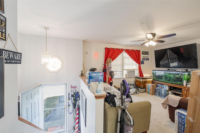 living area featuring cooling unit, ceiling fan, and carpet floors