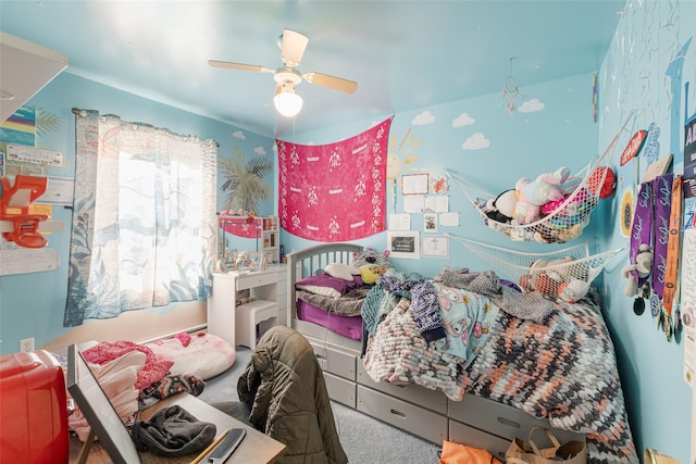 carpeted bedroom featuring ceiling fan