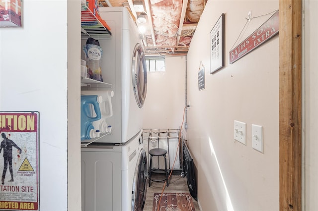 washroom with stacked washer and clothes dryer