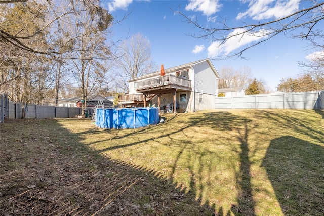 exterior space with a fenced backyard, a fenced in pool, and a wooden deck