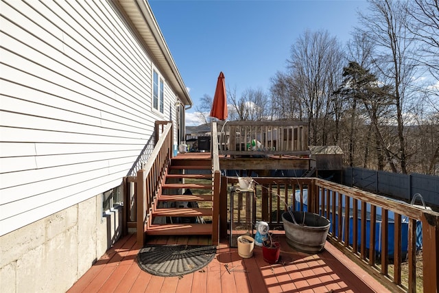 wooden terrace with stairway and fence