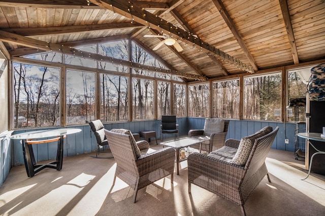 unfurnished sunroom with vaulted ceiling with beams, ceiling fan, and wood ceiling