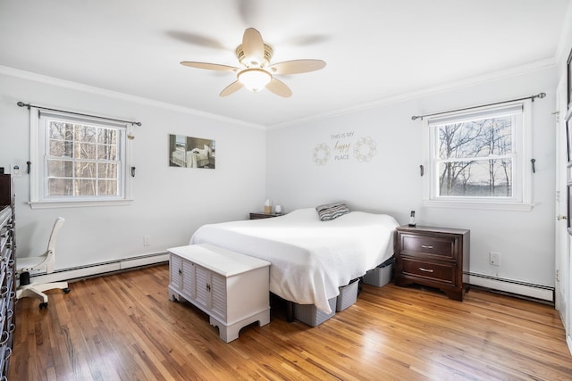 bedroom featuring ceiling fan, ornamental molding, light hardwood / wood-style flooring, and a baseboard radiator