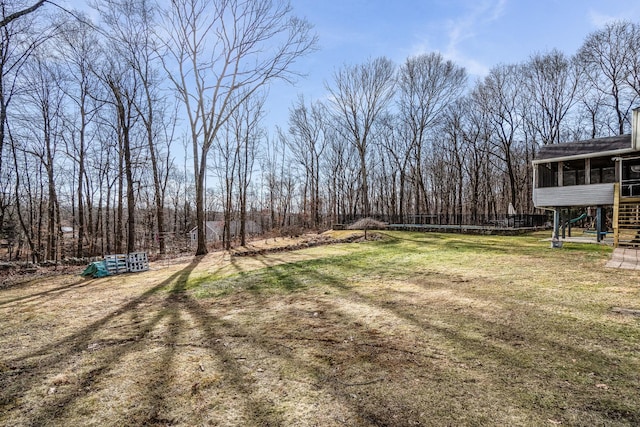 view of yard with a sunroom