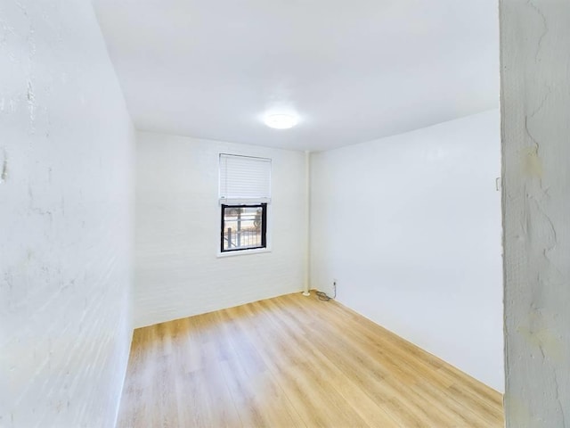 spare room with light hardwood / wood-style floors