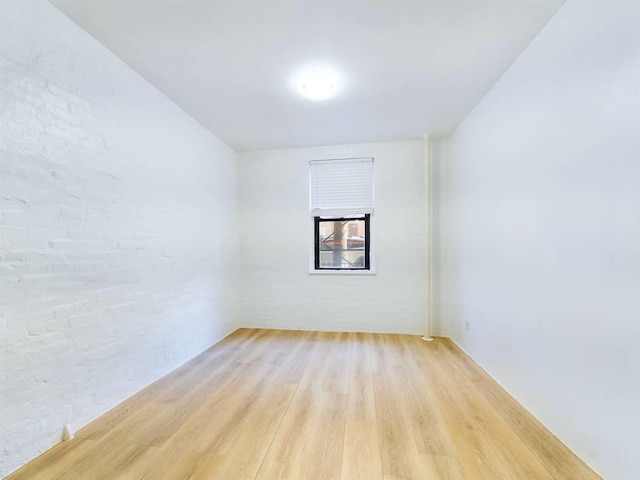 spare room featuring light wood-type flooring