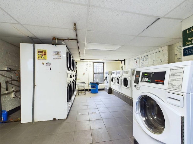 washroom with tile patterned flooring, separate washer and dryer, and stacked washer / dryer