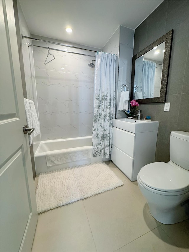 full bathroom with tile patterned flooring, vanity, toilet, and shower / tub combo