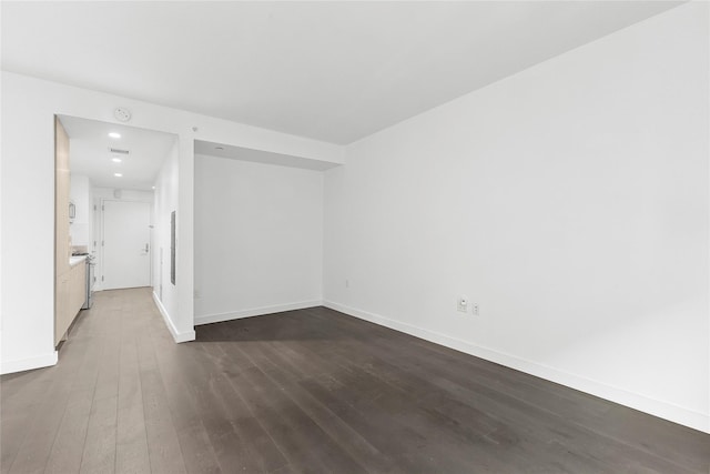 empty room featuring dark hardwood / wood-style floors