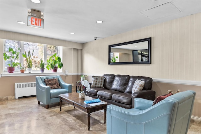 living room with recessed lighting and radiator