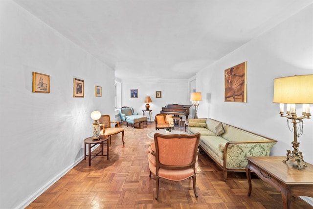 living area featuring baseboards