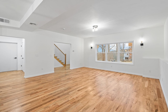 spare room featuring light wood-type flooring