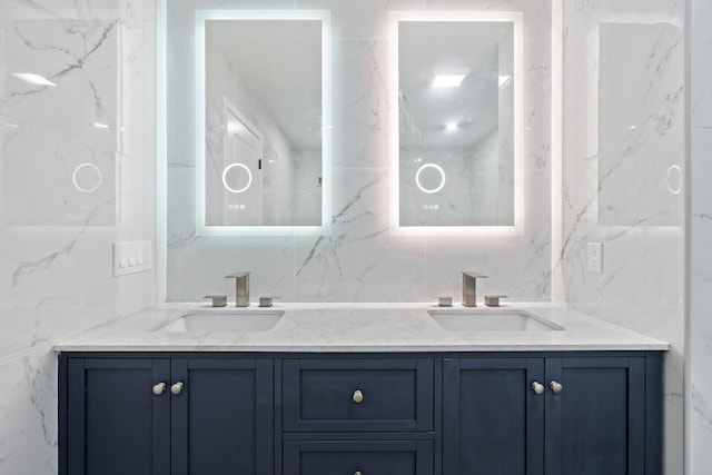 bathroom with vanity and tile walls