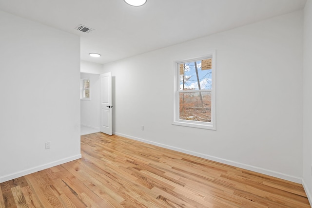 unfurnished room with light hardwood / wood-style flooring