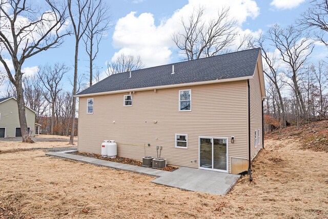 back of house with a patio