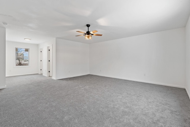 unfurnished room featuring carpet and ceiling fan