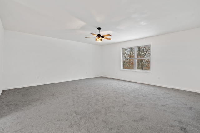 spare room featuring carpet and ceiling fan