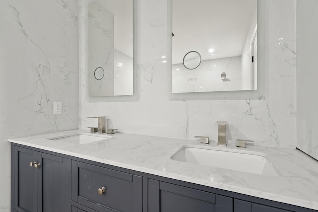 bathroom featuring vanity and tile walls