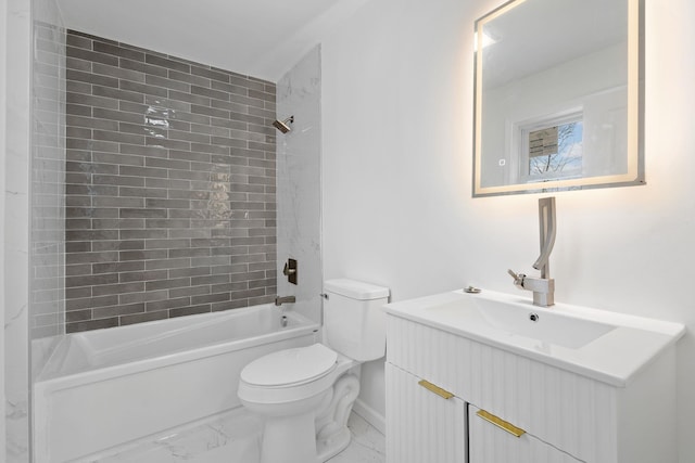 full bathroom with toilet, vanity, and tiled shower / bath