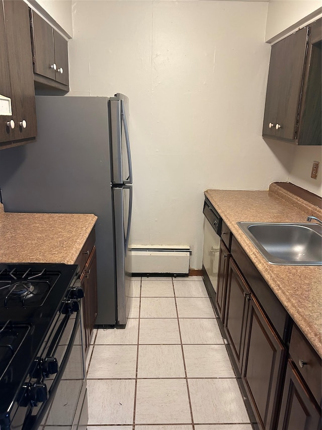 kitchen with a baseboard radiator, range, dishwasher, sink, and light tile patterned floors