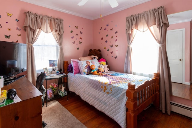 bedroom featuring ceiling fan, dark wood-type flooring, a baseboard radiator, and ornamental molding