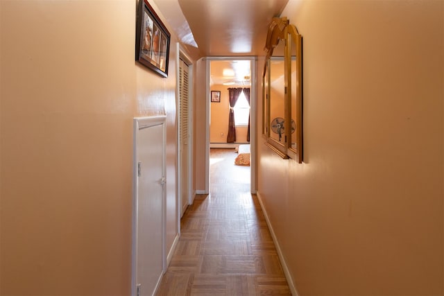 hall featuring parquet flooring