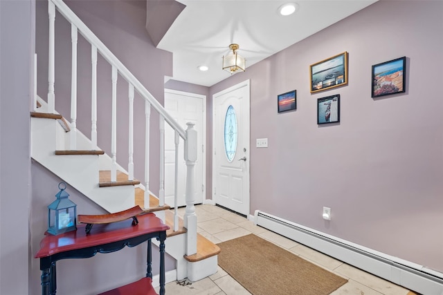 tiled foyer entrance with baseboard heating