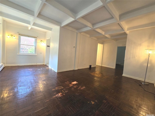 empty room featuring beam ceiling and coffered ceiling