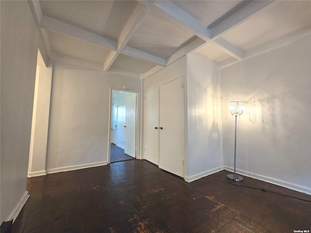 unfurnished room featuring beamed ceiling and coffered ceiling